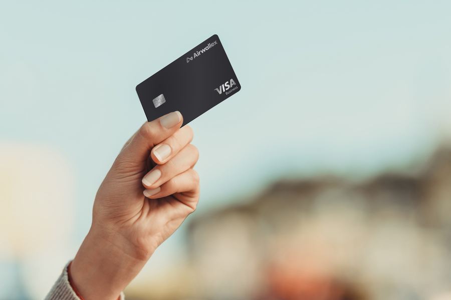 Airwallex Visa Business card held up against the sky